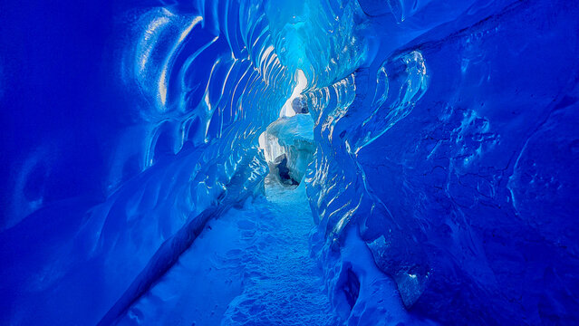 Extrem blue Ice tunnel in the frozen ice waves, Queen Maud Land, Antarctica