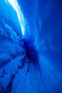 Extrem blue Ice tunnel in the frozen ice waves, Queen Maud Land, Antarctica