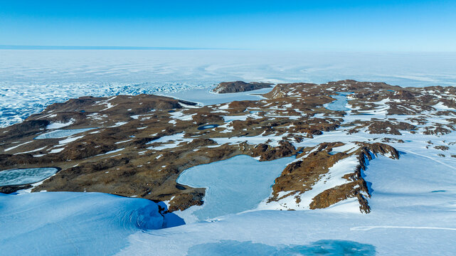 Aerial of a luxurious camp on below a glacier, Queen Maud Land, Antarctica