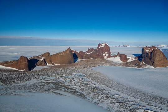 Mountain tops peeking out of the glaciers of Queen Maud Land, Antarctica