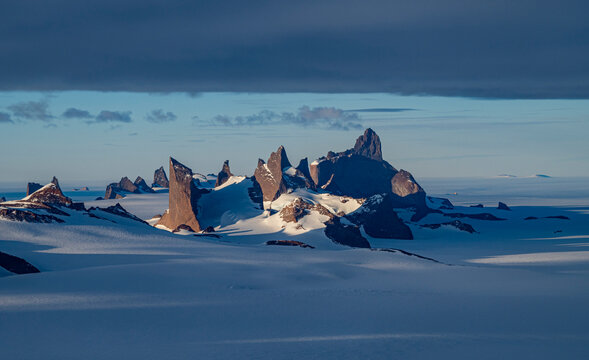 Mountain tops peeking out of the glaciers of Queen Maud Land, Antarctica