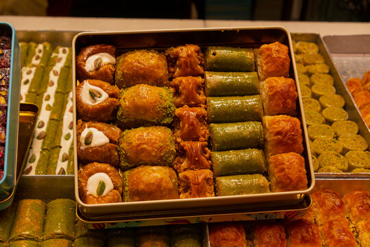 Discover popular traditional Middle Eastern desserts in a colorful display with various sweets and pastries in Istanbul, Turkey