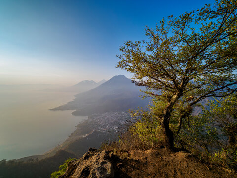View from Rostro Maya or Indian Nose over Lake Atitlan and San Juan La Laguna towards San Pedro Volcano at sunrise, Solola Department, Guatemala