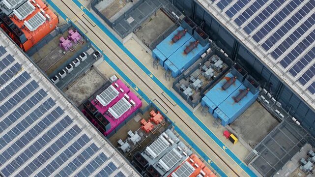 Close Up Aerial View of Industrial Data Center Cooling Units and Backup Power Generators in the UK