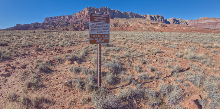 Sign instructs visitors to take photos and not remove objects at Sun Valley Mine Trailhead in Vermilion Cliffs National Monument, Arizona