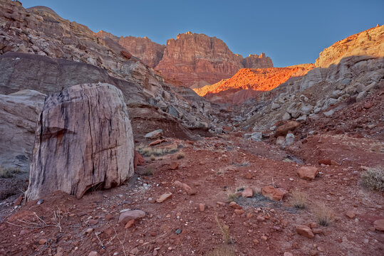 End of the Sun Valley Mine Trail with rock formations and cliffs in the background in Arizona during sunset