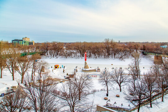 Winter activities at Forks Historic Port attract many visitors and families in Winnipeg Manitoba during cold season