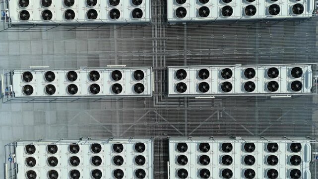 Close Up Aerial View of Large Rooftop HVAC Cooling Fans and Ventilation Systems on Modern Data Center