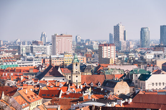 Panoramic view of Bratislava's historic Old Town with modern skyline in the background from castle hill