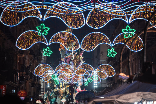 Colorful Fallas monument with festive lights in central Valencia during the traditional Las Fallas celebration