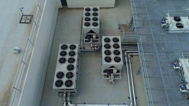 Aerial Detail of Rooftop Industrial Air Conditioning Units and Chillers on data center roof Facility
