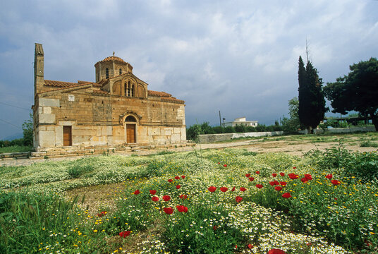 Byzantine church surrounded by flowers in Argolis countryside Peloponnese Greece