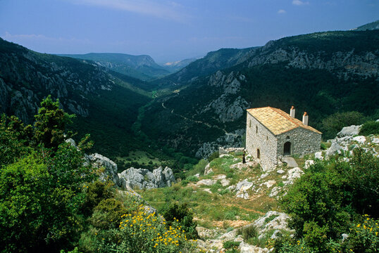 Scenic view of sheepfold and monastery in a valley near Pelei village in Greece