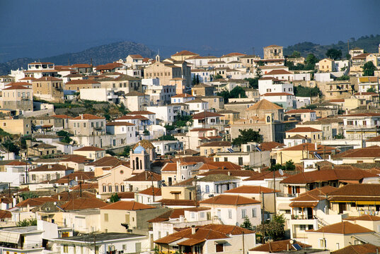 Exploring the varied architecture and rooftops of Kranidi in Greece, featuring traditional Mediterranean styles and a distinct skyline