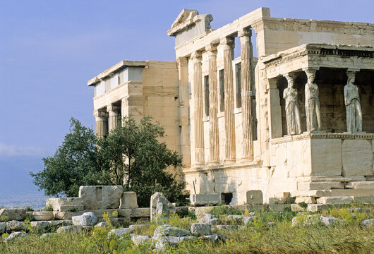Erechtheum features Caryatids standing alongside ancient ruins on the Acropolis overlooking Athens