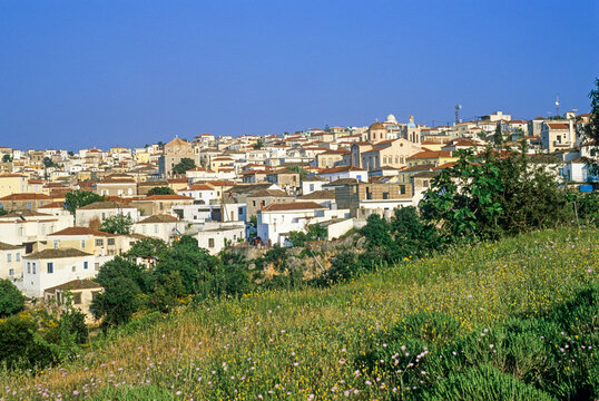 Historic buildings and green fields describe the landscape of Kranidi, Argolid, in a sunny day typical for Greece