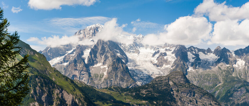 View over Mont Blanc massif from belvedere of Arpy near La Thuile in Aosta Valley Italy during a sunny day with clouds