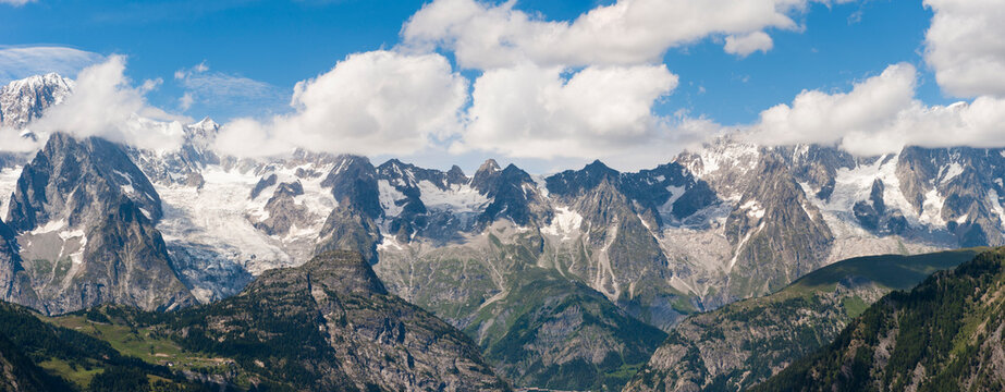 View of Mont Blanc massif from Arpy belvedere in Aosta Valley Italy with surrounding mountains and clouds