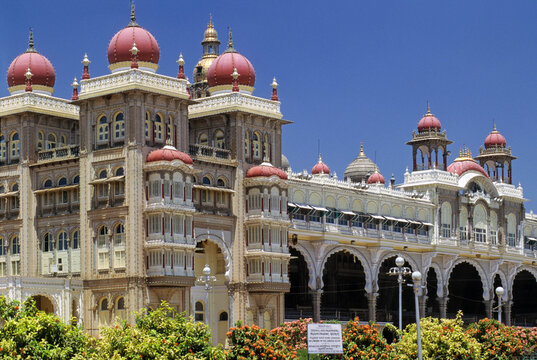 Grand architecture and colorful domes adorn the exterior of Mysore Palace in Karnataka on a sunny day