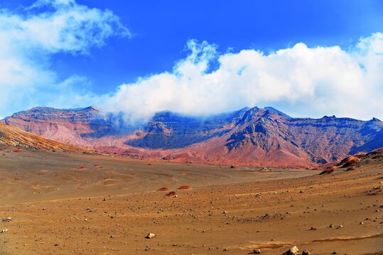 Mt Aso seen in sunny weather during autumn in Kumamoto Prefecture, Japan with clear blue sky and volcanic landscape