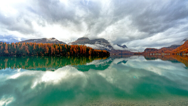 Autumn reflections at Lake Sils, Maloja Region, Engadin, Graubunden, Switzerland