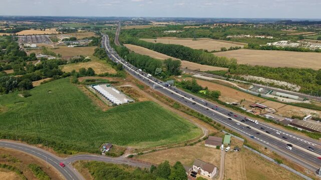 Aerial view of battery energy storage facility and busy M1 motorway near Luton UK