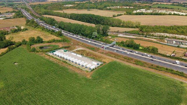 Aerial view of battery energy storage facility and busy M1 motorway near Luton UK