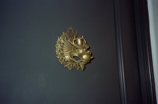 Gold Ornate Dragon Wall Decoration on Dark Background