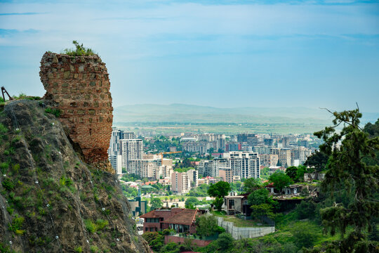 Beautiful medieval aerial view from historic mountain fort overlooking Tbilisi city.