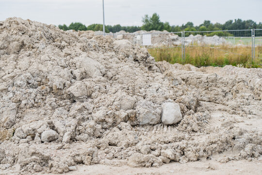 Uncompacted earthworks subgrade pile with clay and excavated soil material for site clearing and civil infrastructure