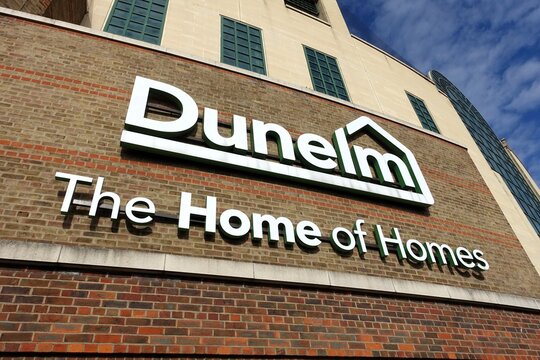 Exterior store signage of the Dunelm branch at the Harlequin Centre in Watford. Dunelm are a prominent UK home furnishings and homewares retailer.