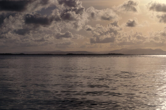 Golden Hour Sky and Calm Ocean Waters at Sunset in Morrocoy National Park, Falcon State, Venezuela