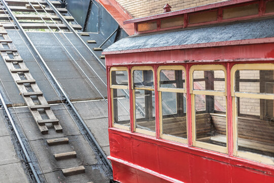 Weathered Red Cable Car Station on Steep Incline Railway Track