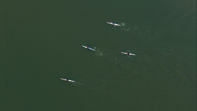 Aerial view of kayakers paddling on the calm green waters of Arroyo Martires in Posadas, Misiones Province, Argentina.