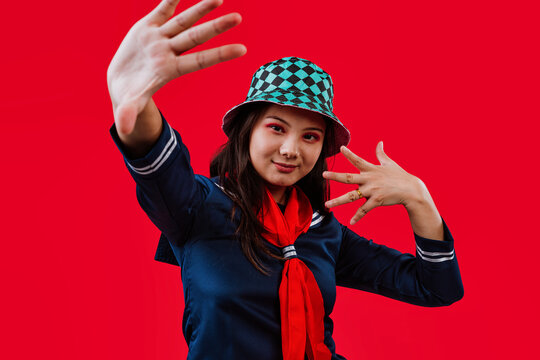 Young asian woman posing wearing school uniform cosplay