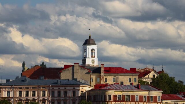 A large city hall building with a clock tower on top, ideal for use in architecture, cityscape, and urban planning images