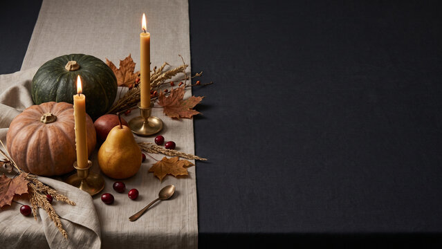 Autumn Pumpkin Still Life with Candles and Dark Copy Space