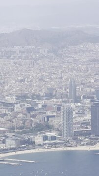 Landing in Barcelona, Spain, Catalonia. Traveling by air. View window airplane wing engine jet flying trip Barcelona city county vacations. Central beach aerial view Sant Miquel Sebastian plage 