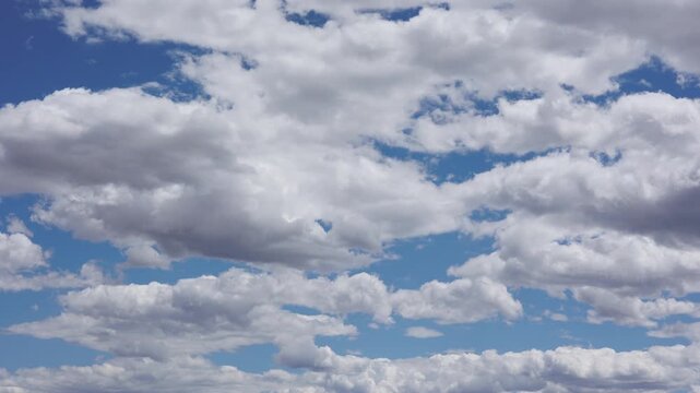 Blue Sky and Puffy Clouds Timelapse Background Zoom Out