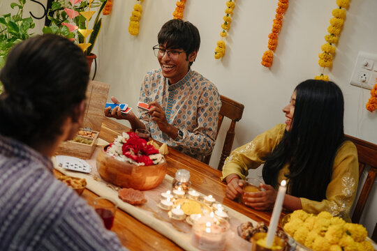 Friends Gather for a Game Night During a Festive Celebration