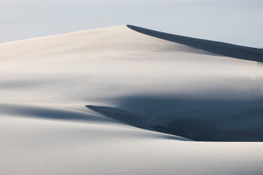 Sharp Sand Dune Peak Against Clear Sky