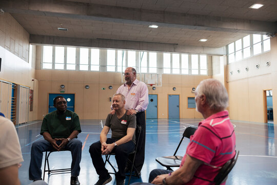 Diverse older men participating in community support group activity