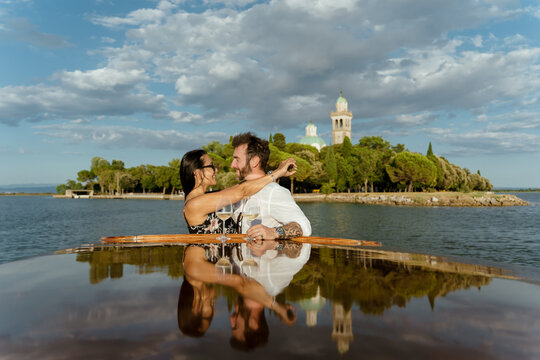 Romantic Couple on Scenic Boat Tour at sunset