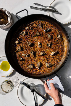 Overhead view of a traditional Spanish rice paella before serving