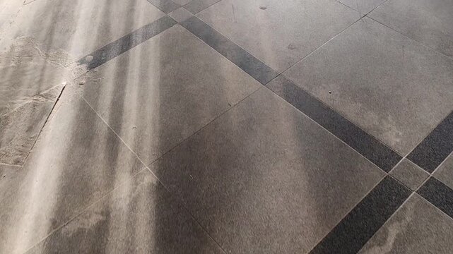 Abstract floor texture with geometric lines and patterns, gray tones, urban background