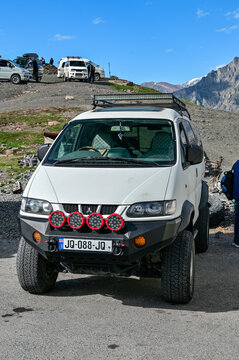 White Mitsubishi Delica Space Gear 4x4 minivan with off-road modifications and auxiliary lights in Stepantsminda near Kazbegi, all-terrain 4WD vehicle, Mtskheta-Mtianeti, Georgia 30.04.25