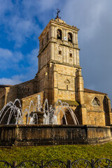 Fototapeta premium Collegiate church of San Miguel featuring Gothic, Renaissance, and Herrerian architecture on the main square, Aguilar de Campoo, Palencia, Castile and Leon, Spain.