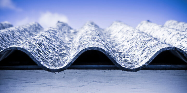 AGED ASBESTOS ROOF WITH DETERIORATED CORRUGATED ASBESTOS CEMENT SHEETS - EXTREMELY DANGEROUS BUILDING MATERIAL, SERIOUS HEALTH HAZARD, SILENT HIDDEN KILLER