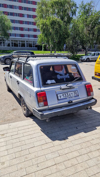 Silver VAZ-2104 Lada station wagon (classic car from the 1980s/1990s) with a roof rack and Russian license plate in Astrakhan; classic Soviet passenger car, Astrakhan, Russia 13.05.25