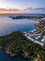 Obraz premium Aerial View of Manly Beach and Cabbage Tree Bay at Sunset, Sydney, Australia - Beautiful Coastal Cityscape and Ocean Landscape